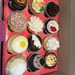 Dozen cup cakes in a variety of flavors.