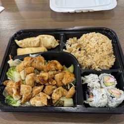 Ichiro Go - Chicken teriyaki bento box includes: California rolls, pork dumplings, fried rice, and spring roll