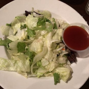 George's Pizza - Iceberg lettuce salad w/ western dressing - Pizza Near Me - Pella, Iowa George's Pizza - Iceberg lettuce salad w/ western dressing - Pizza Near Me - Pella, Iowa