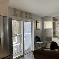 Lake Harmony Inn - Living room with sliding door right onto patio with view of lake.