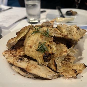Tramonto Restaurant - Starter - Grilled seasoned rosemary flat bread - addictive - Italian Near Me - Hawthorne, New York Tramonto Restaurant - Starter - Grilled seasoned rosemary flat bread - addictive - Italian Near Me - Hawthorne, New York