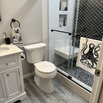 Giunta Construction Company - a bathroom with a toilet and shower - General Contractors Near Me Giunta Construction Company - a bathroom with a toilet and shower - General Contractors Near Me