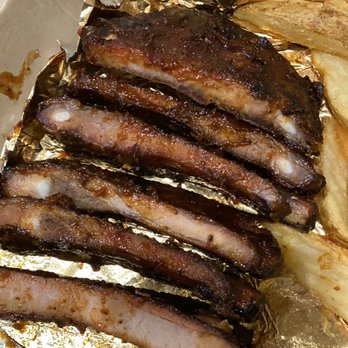 Famous Dave's Bar-B-Que - $19 worth of ribs? Pictures don't show how thin they really are. - Barbeque Near Me - Kalispell, Montana