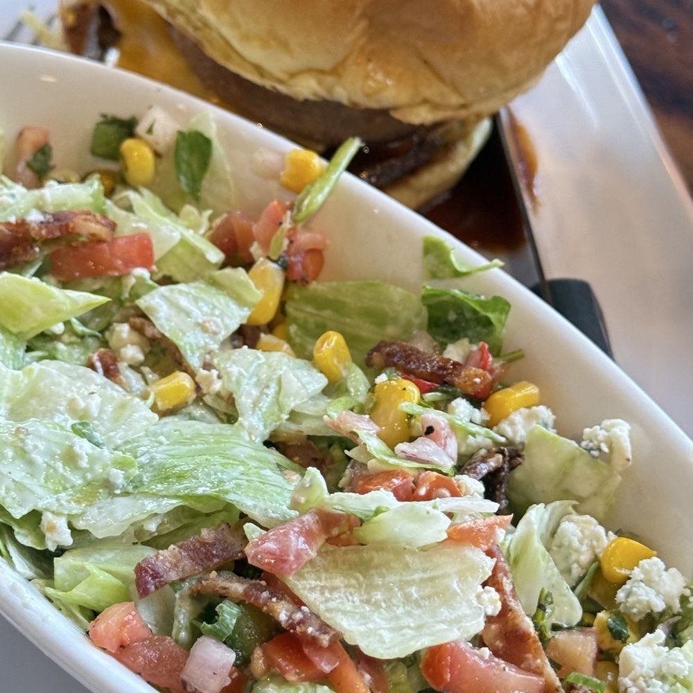 Finney's Crafthouse - Salad (my friend mixed it up already) and burger - New American Near Me - Brea, California