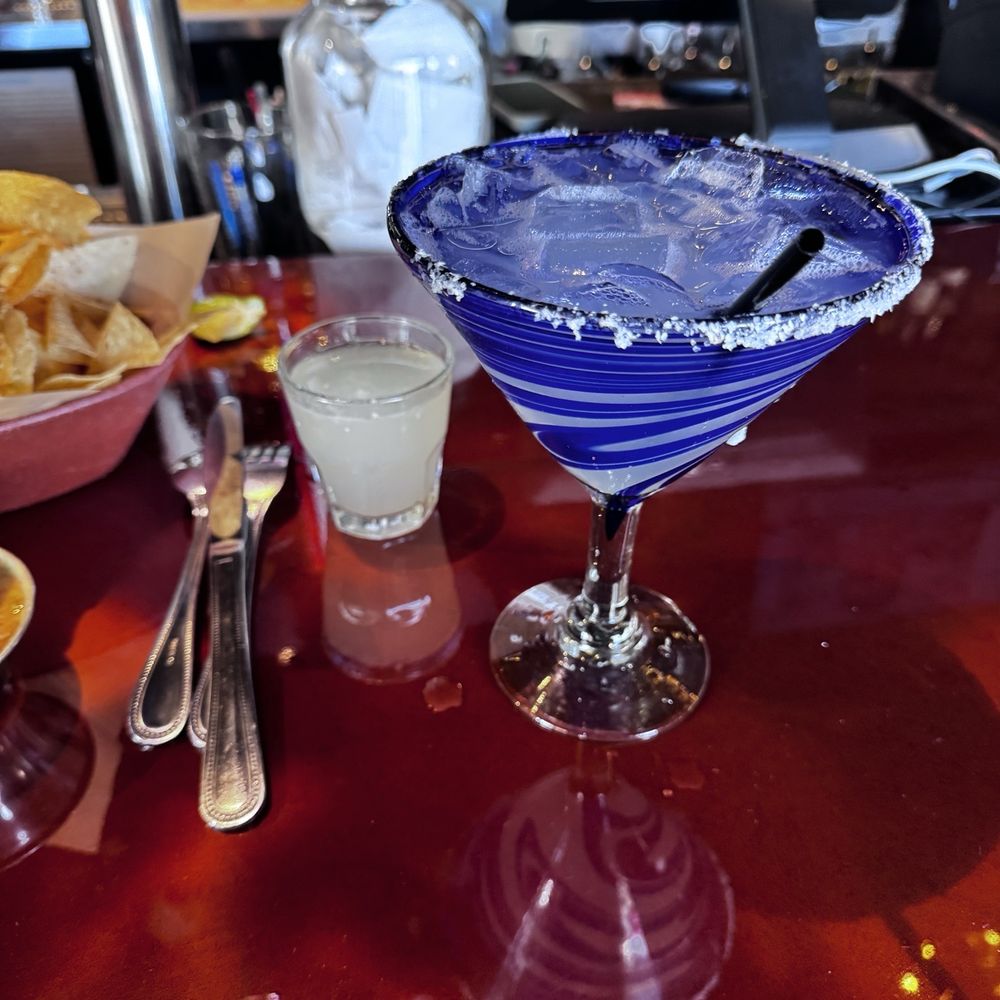Happy Hour house margarita on the rocks. Good value. Tastes good. Bar staff is excellent