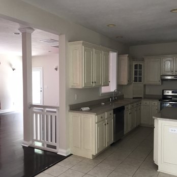 Ameriserve - a kitchen with white cabinets and black appliances - General Contractors Near Me - Noblesville, Indiana Ameriserve - a kitchen with white cabinets and black appliances - General Contractors Near Me - Noblesville, Indiana