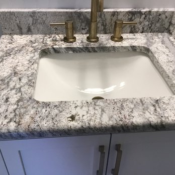 Keystone Granite - a bathroom sink with faucet and faucet - Countertop Installation Near Me - Fletcher, North Carolina