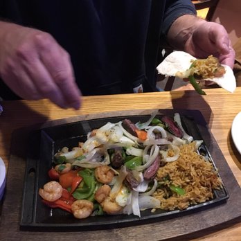 Chili's - Onion bell pepper salad is what he had. This is him making his first bite to eat. So count the meat in it!! - Tex-Mex Near Me - Laramie, Wyoming