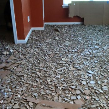 Atlantic Floors - Taking up tile on main level, we left it in kitchen areas - Flooring Near Me - Fairfax, Virginia