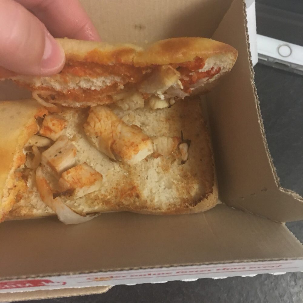 Domino's Pizza - a hand holding a half eaten pizza - Pizza Near Me - Lawton, Oklahoma Domino's Pizza - a hand holding a half eaten pizza - Pizza Near Me - Lawton, Oklahoma