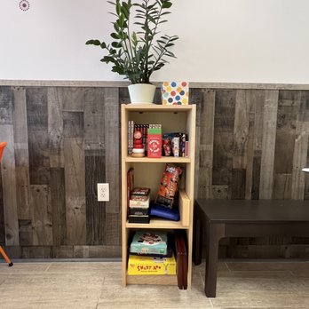 Tea Top - Bookshelf with board games and card games - Bubble Tea Near Me - Flowery Branch, Georgia Tea Top - Bookshelf with board games and card games - Bubble Tea Near Me - Flowery Branch, Georgia