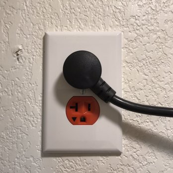 Strong Tower Electric - an electrical outlet on a wall - Electricians Near Me - Austin, Texas