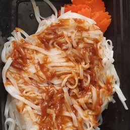 Cold unseasoned blob of noodles and barely cooked vegetables smeared with sticky, dry peanut sauce.
