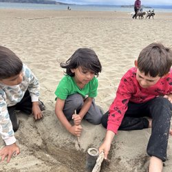 Music, Art & Adventure Summer Camp - Kids playing together at our Baker Beach camp
