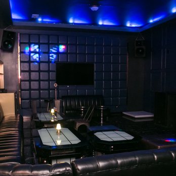 Theme House - a living room with black leather furniture - Karaoke Near Me - Chicago, Illinois Theme House - a living room with black leather furniture - Karaoke Near Me - Chicago, Illinois