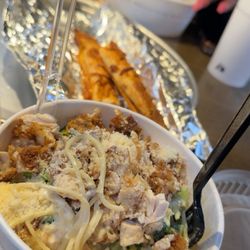 Piada Italian Street Food - Crispy chicken Alfredo with bacon, broccoli, Parmesan cream sauce and Parmesan cheese - ft. the Parmesan Piada Stick in the back.
