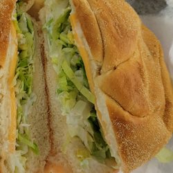 Two slices of cjeeoin a lettuce sandwich