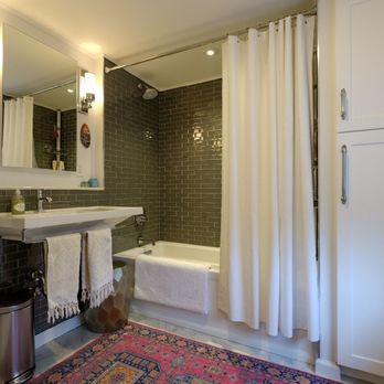 Trusted Home Solutions - a bathroom with a sink, toilet, and shower - General Contractors Near Me