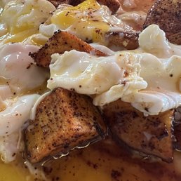 Classic Traditional Breakfast* - poached eggs broken over potatoes