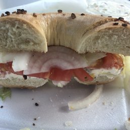 Garlic bagel with nova, cream cheese, lettuce, tomatoes, onions & capers Garlic bagel with nova, cream cheese, lettuce, tomatoes, onions & capers