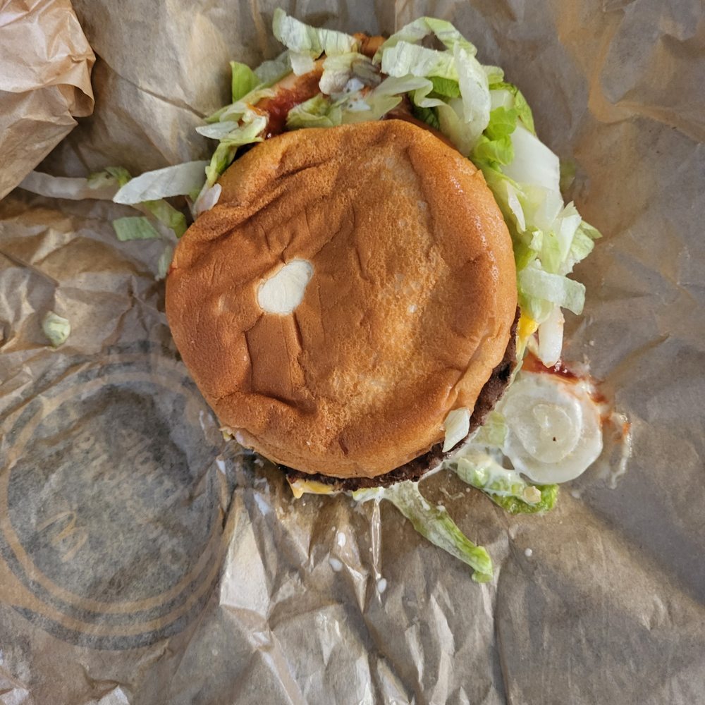 a hamburger with lettuce and tomato a hamburger with lettuce and tomato
