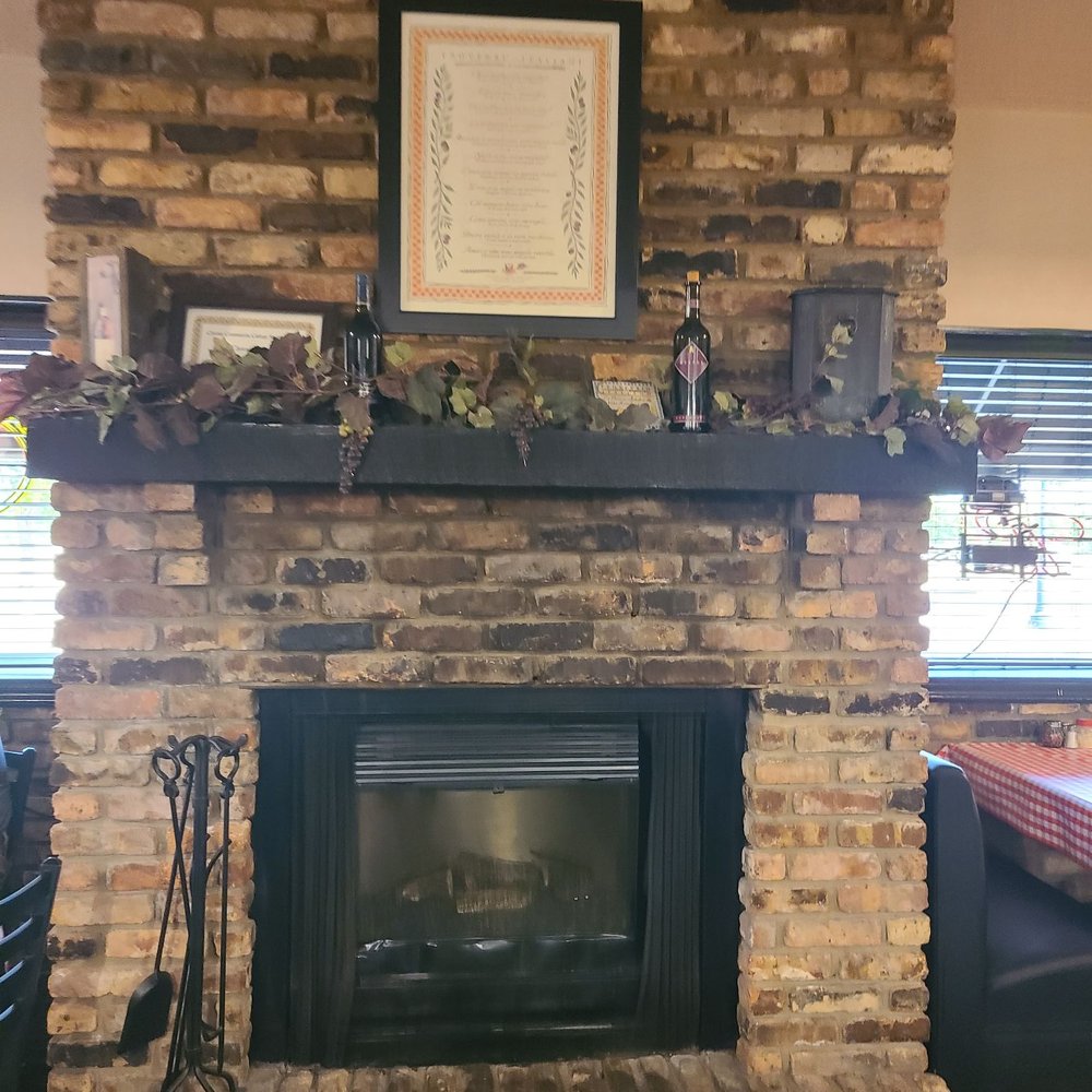 Vitales - A fireplace in 1 dining room - Pizza Near Me - Clinton, Iowa Vitales - A fireplace in 1 dining room - Pizza Near Me - Clinton, Iowa