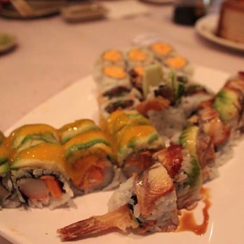 Sushi Today - Hawaiian Roll on the left drizzled in delicious mango sauce, and black dragon roll on the right wrapped in BBQ unagi eel - Sushi Bars Near Me - Whitby, Ontario Sushi Today - Hawaiian Roll on the left drizzled in delicious mango sauce, and black dragon roll on the right wrapped in BBQ unagi eel - Sushi Bars Near Me - Whitby, Ontario