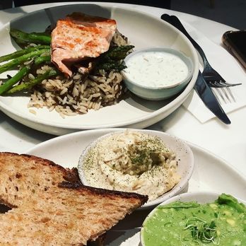 The Well - New York - Yummy salmon, rice, asparagus, hummus, and avocado dip at The Well Kitchen and Table. - Yoga Near Me - New York, New York