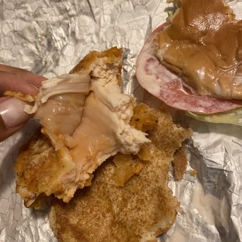 Wendy's - a hand holding a half eaten sandwich - Fast Food Near Me - Batavia, Illinois Wendy's - a hand holding a half eaten sandwich - Fast Food Near Me - Batavia, Illinois