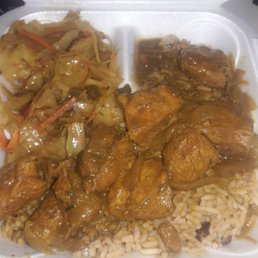 Curry chicken with rice, peas and cabbage