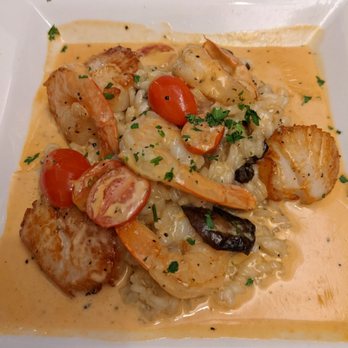 Woolley’s Kitchen & Bar - Shrimp and scallops atop risotto and cream sauce - Steakhouses Near Me - Bloomington, Minnesota Woolley’s Kitchen & Bar - Shrimp and scallops atop risotto and cream sauce - Steakhouses Near Me - Bloomington, Minnesota