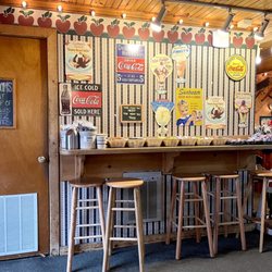 Fred's Backside Deli - Hightop area where you can stay and eat or wait for takeout food to go.