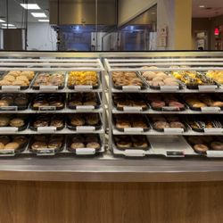 Krispy Kreme - Display with all the doughnut options.