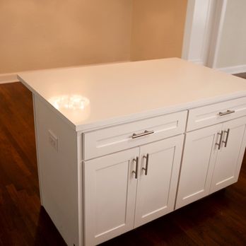 Solis General Contractor - A Cottage Kitchen Island w/ White Quartz Shaker Style Cabinets Home Depot Pulls Plenty of Storage Space - Painters Near Me - San Antonio, Texas Solis General Contractor - A Cottage Kitchen Island w/ White Quartz Shaker Style Cabinets Home Depot Pulls Plenty of Storage Space - Painters Near Me - San Antonio, Texas