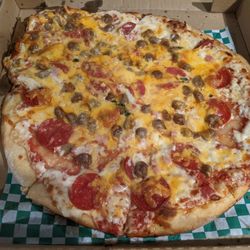 Pizza Bella - A sloppy pathetically over topped pizza