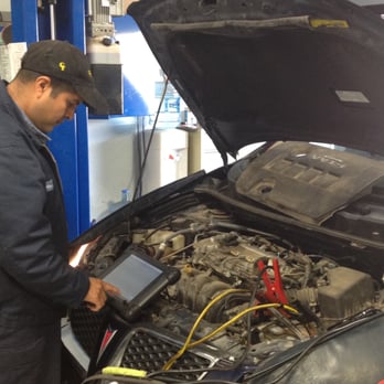 Wheat State Automotive - Wheat State Auto's owner Alberto working hard for a customer! - Auto Repair Near Me - Wichita, Kansas Wheat State Automotive - Wheat State Auto's owner Alberto working hard for a customer! - Auto Repair Near Me - Wichita, Kansas