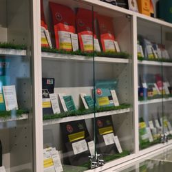 La Canapa - Step inside our tranquil store environment, where a vast array of cannabis products is presented in an accessible and orderly fashion.