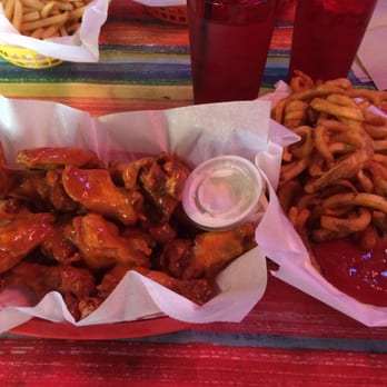 Ray's Original Buffalo Wings - 12 bone-in Hot wings and a small order of the curly fries. - Burgers Near Me - Omaha, Nebraska Ray's Original Buffalo Wings - 12 bone-in Hot wings and a small order of the curly fries. - Burgers Near Me - Omaha, Nebraska