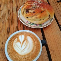 Bread and Butler - Flat white and a cardamom bun in a safely socially distant environment.