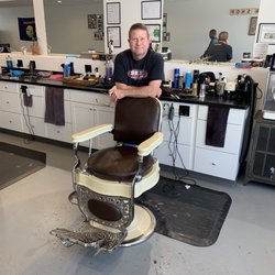 Master Barber of Missoula - The owner with one of his classic barbershop chairs.