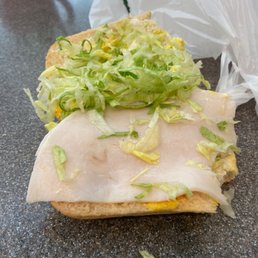 a sandwich with lettuce and cheese a sandwich with lettuce and cheese