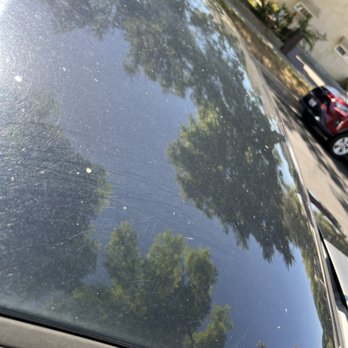Quick Quack Car Wash - You can still see dust on the car and you can see the rollers only touched the edge of the car - Car Wash Near Me - Corona, California