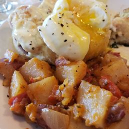 Poached eggs Benedict with a side of homefries. A favorite with a mimosa Poached eggs Benedict with a side of homefries. A favorite with a mimosa