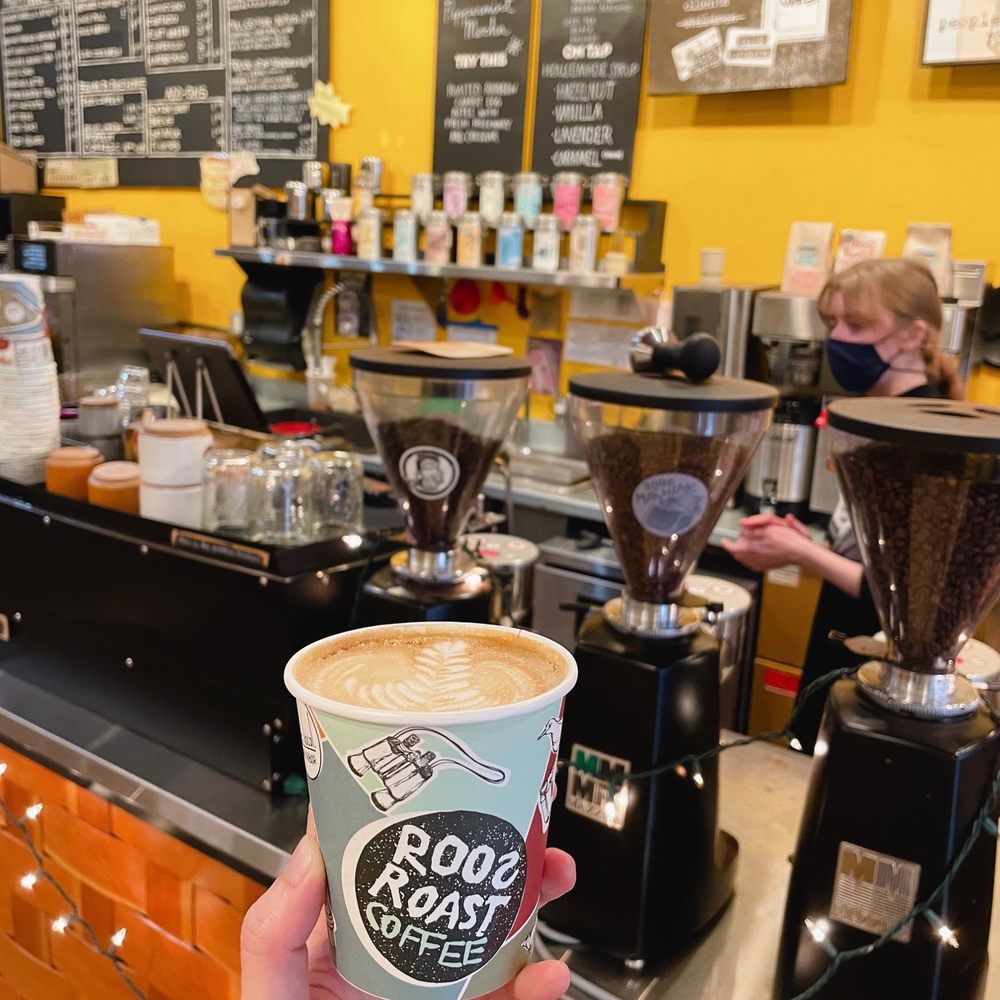RoosRoast Liberty - a person holding a cup of coffee - Cafes Near Me - Ann Arbor, Michigan RoosRoast Liberty - a person holding a cup of coffee - Cafes Near Me - Ann Arbor, Michigan