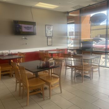 Pizza Parlor - tables and chairs in a restaurant - Pizza Near Me - Pearland, Texas