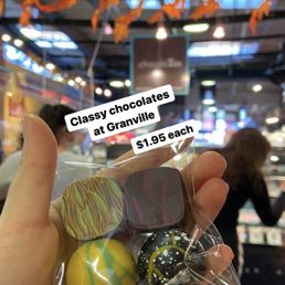 a person holding a bag of chocolates a person holding a bag of chocolates