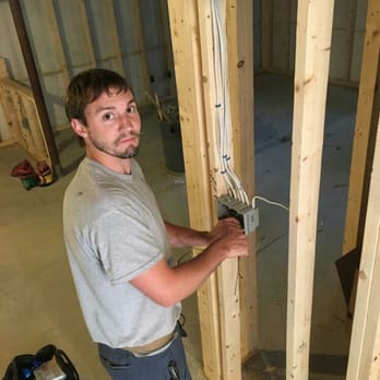 Fraser Electric - Chris Fraser (owner) working on a basement remodel. - Electricians Near Me