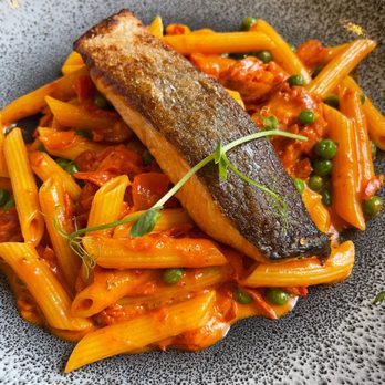 Turpins Bar & Grill - Pan roasted salmon supreme with green pea and chorizo penne pasta - Modern European Near Me - Twycross, LEC