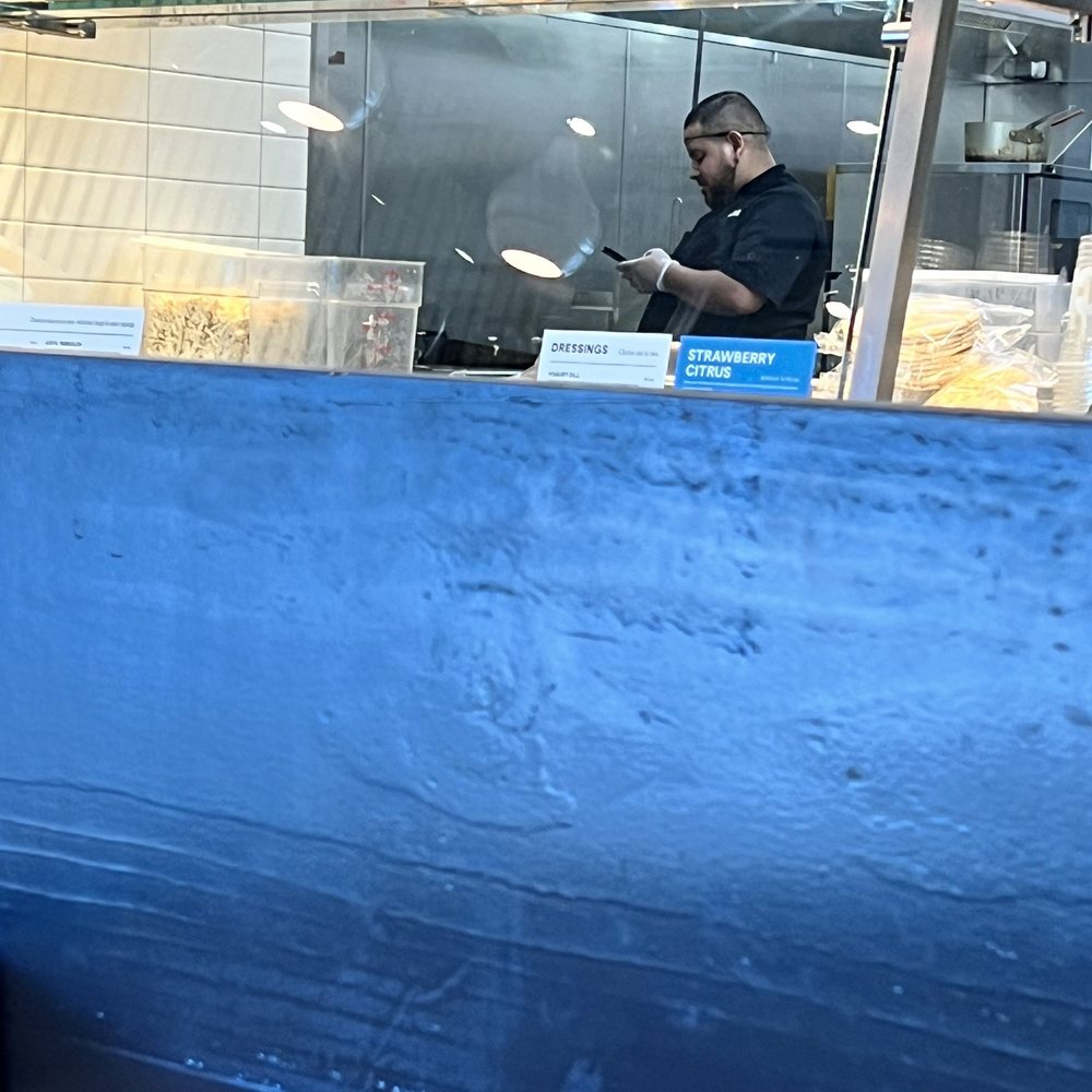 CAVA - Chef texting with gloves on then touching the food - Mediterranean Near Me - Scottsdale, Arizona CAVA - Chef texting with gloves on then touching the food - Mediterranean Near Me - Scottsdale, Arizona