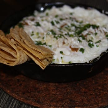 Toro - Huevos Rancheros: Eggs over easy, black beans, crispy tortillas, salsa roja and cotija cheese - Tapas Bars Near Me - Boston, Massachusetts Toro - Huevos Rancheros: Eggs over easy, black beans, crispy tortillas, salsa roja and cotija cheese - Tapas Bars Near Me - Boston, Massachusetts